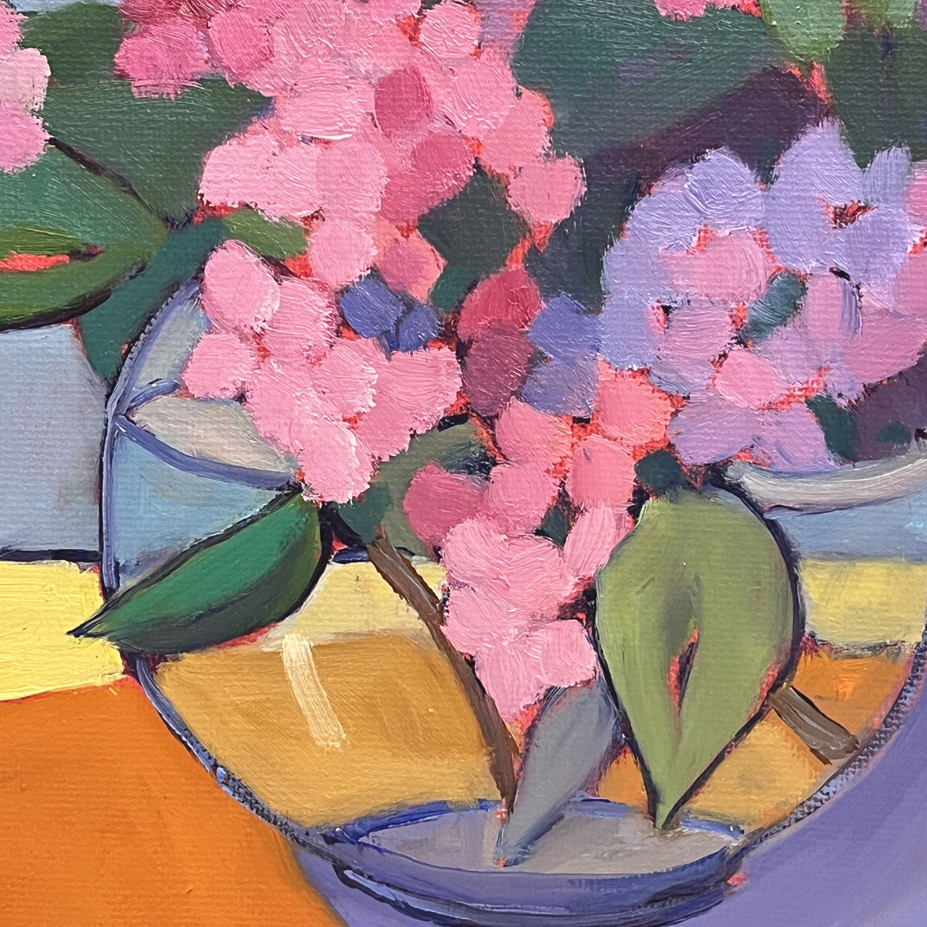 This is a close up view of the texture in the brushwork of the oil painting and provides a sense of how the colors are layered to create a warm inviting visual and sensory experience.